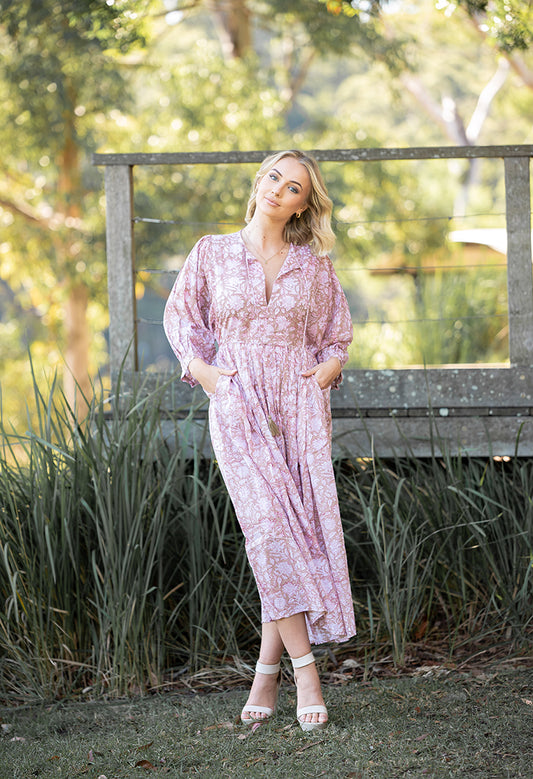 Our Riva Dress is a stunning Bohemian style maxi dress featuring a delicate floral hand block pattern crafted by our partner artisans in Jaipur, India.