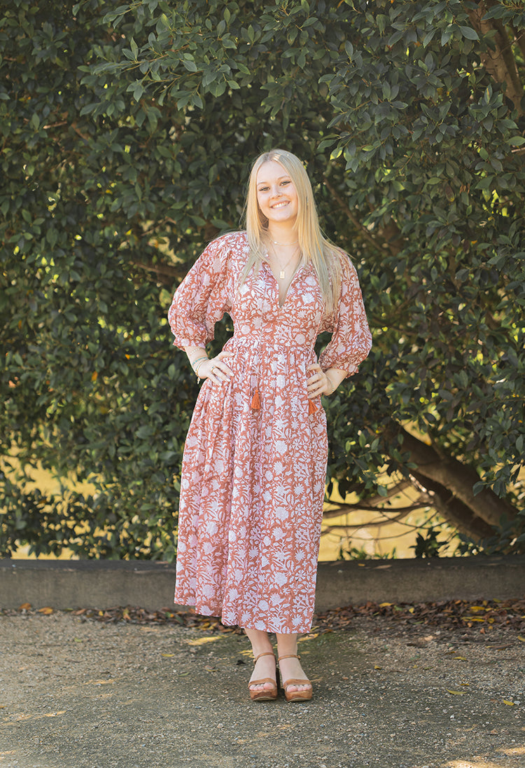 Nora Maxi Dress is a Bohemian style dress with romantic billowy sleeves. Crafted with 100% cotton voile featuring a delicate floral hand block print in a soft rust/beige colourway