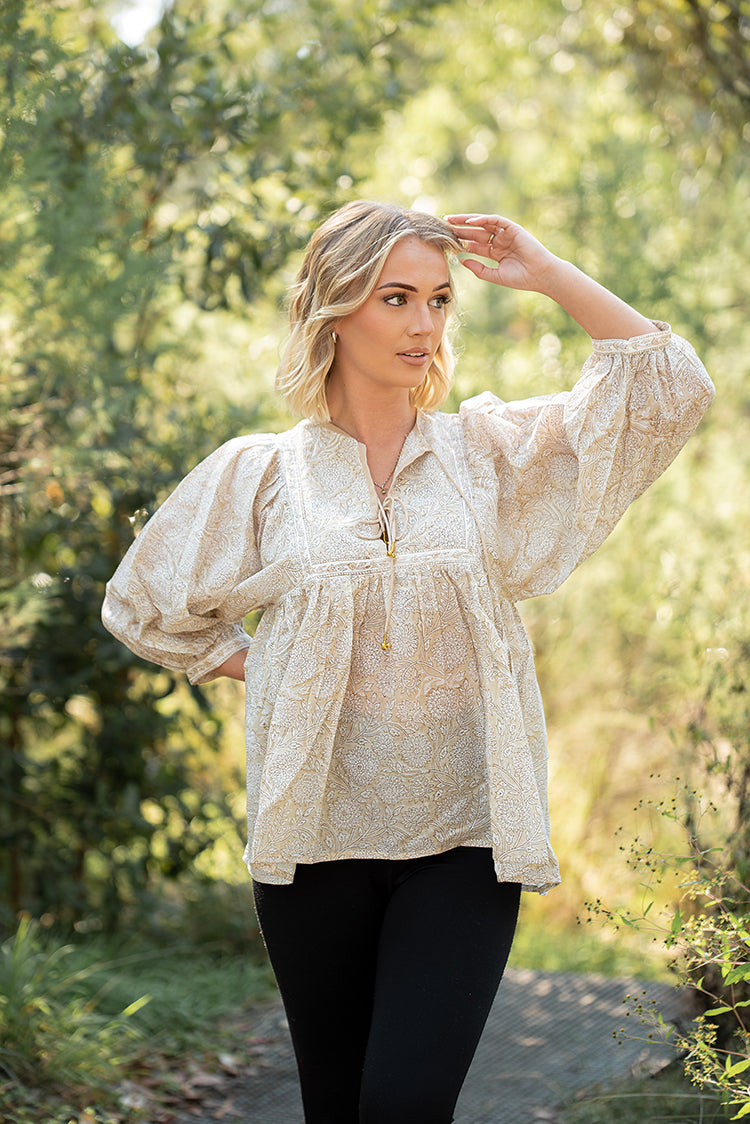 Daisy Top is a light floaty Bohemian style top that is sure to become a staple piece in your wardrobe. Featuring a delicate white floral print on stunning beige colourway on 100% cotton fabric.