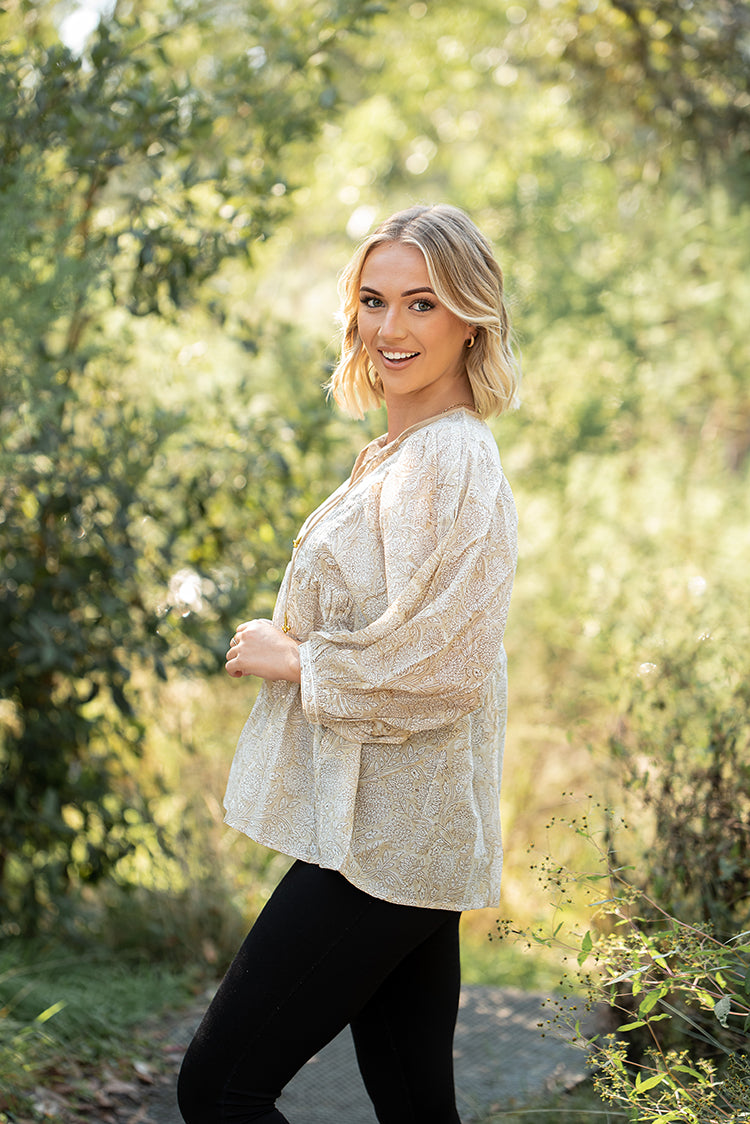 Daisy Top is a light floaty Bohemian style top that is sure to become a staple piece in your wardrobe. Featuring a delicate white floral print on stunning beige colourway on 100% cotton fabric.