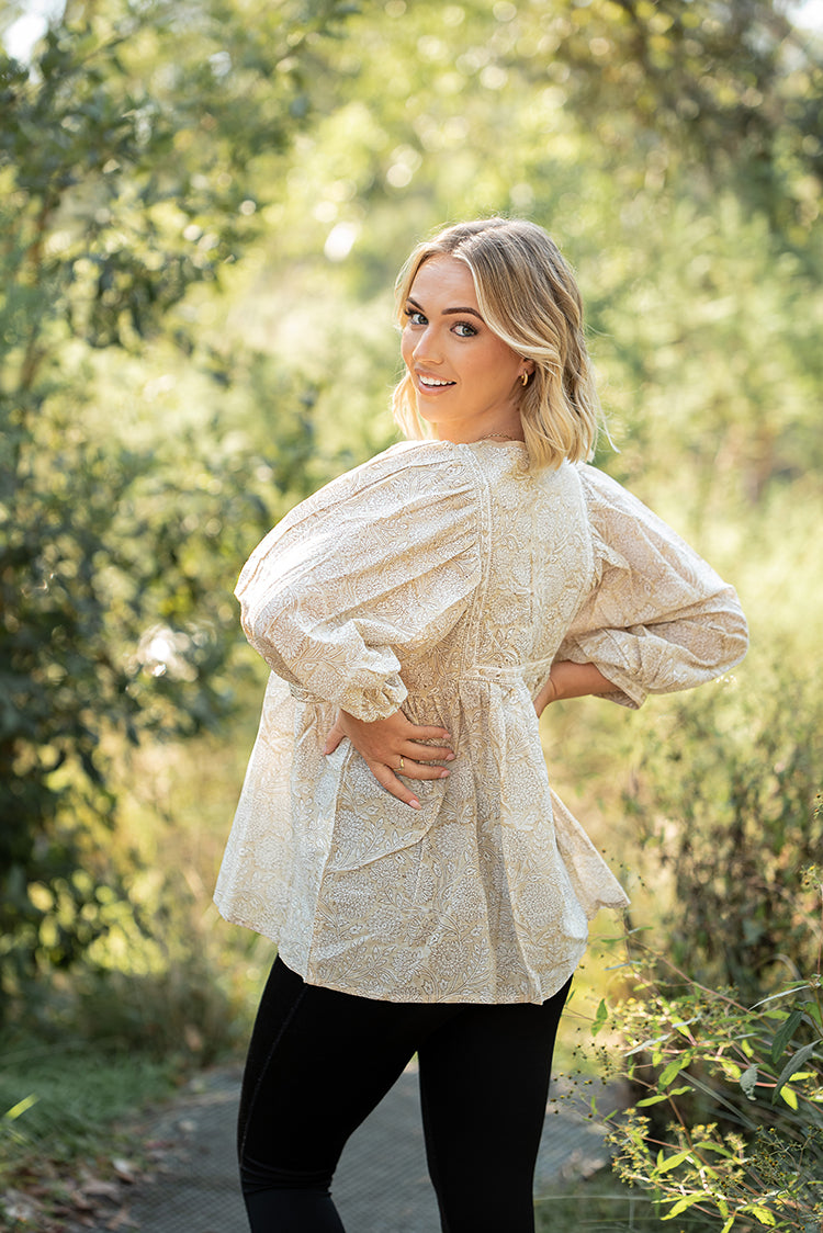 Daisy Top is a light floaty Bohemian style top that is sure to become a staple piece in your wardrobe. Featuring a delicate white floral print on stunning beige colourway on 100% cotton fabric.