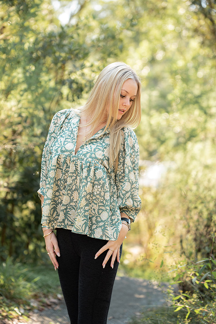 Our Sara Top is a Bohemian style top that is light and flowy. Featuring a floral hand block printed pattern on olive green colourway.