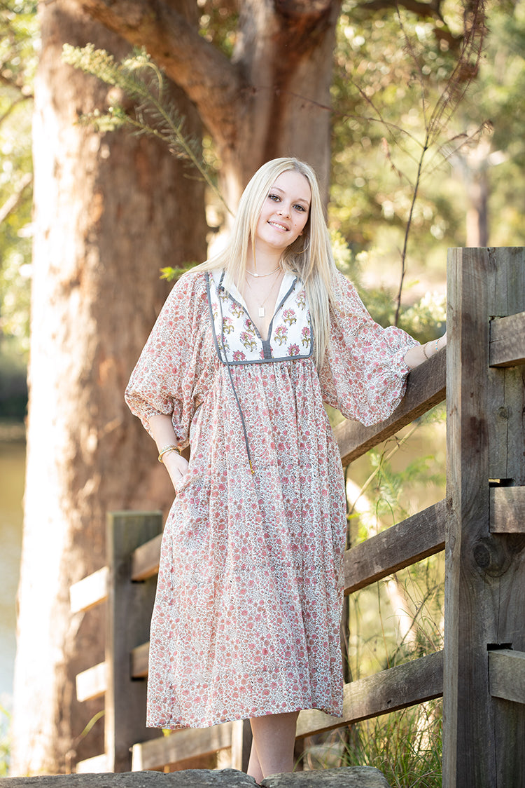 Our Nyla Dress is a stunning Bohemian style dress featuring a contrasting yoke in a simple floral Mehndi pattern. Nyla showcases a cute floral hand block pattern crafted by our partner artisans in Jaipur, India.