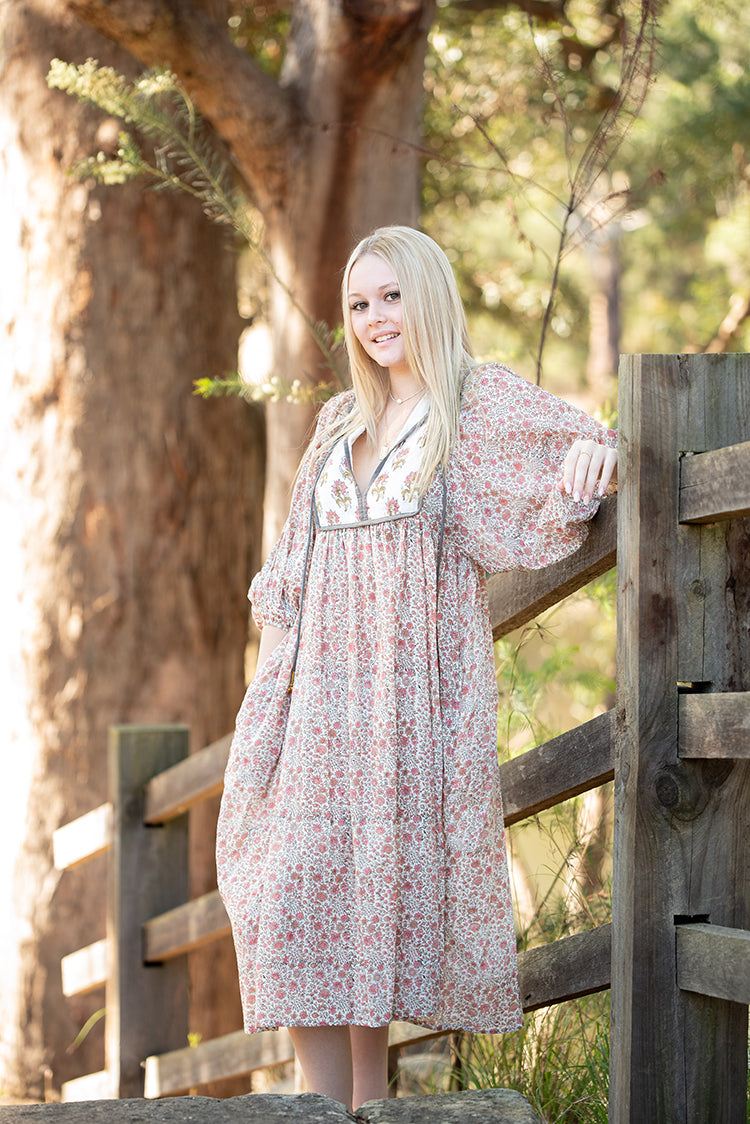 Our Nyla Dress is a stunning Bohemian style dress featuring a contrasting yoke in a simple floral Mehndi pattern. Nyla showcases a cute floral hand block pattern crafted by our partner artisans in Jaipur, India.