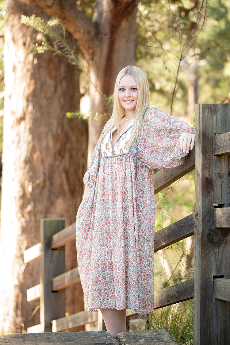 Our Nyla Dress is a stunning Bohemian style dress featuring a contrasting yoke in a simple floral Mehndi pattern. Nyla showcases a cute floral hand block pattern crafted by our partner artisans in Jaipur, India.