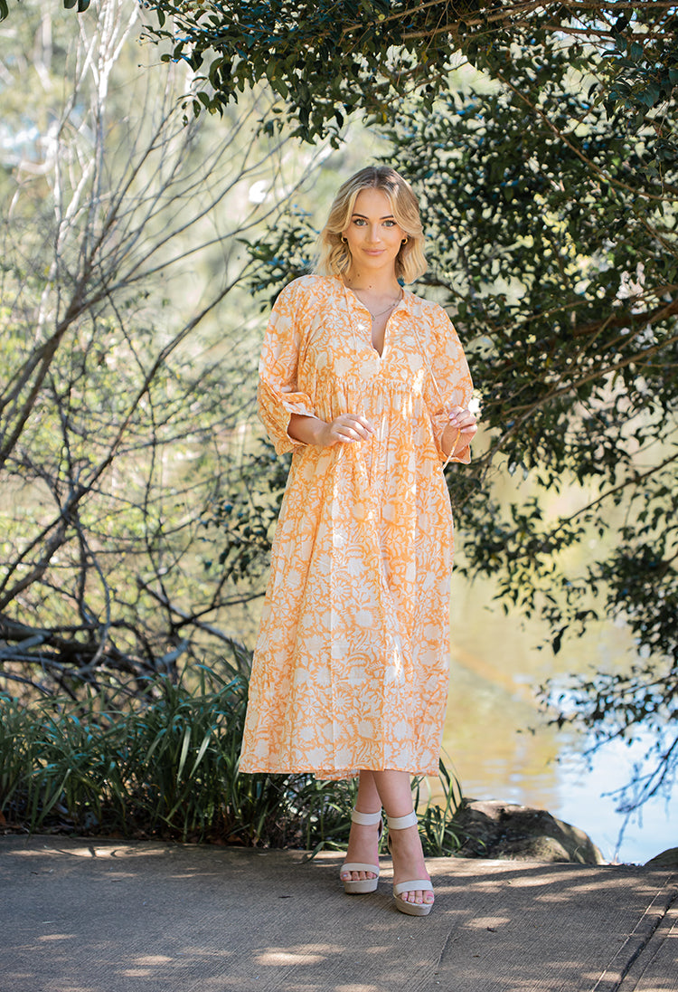 Bohemian style maxi dress featuring delicate floral hand block print in a soft mandarin colourway on 100% cotton voile fabric.