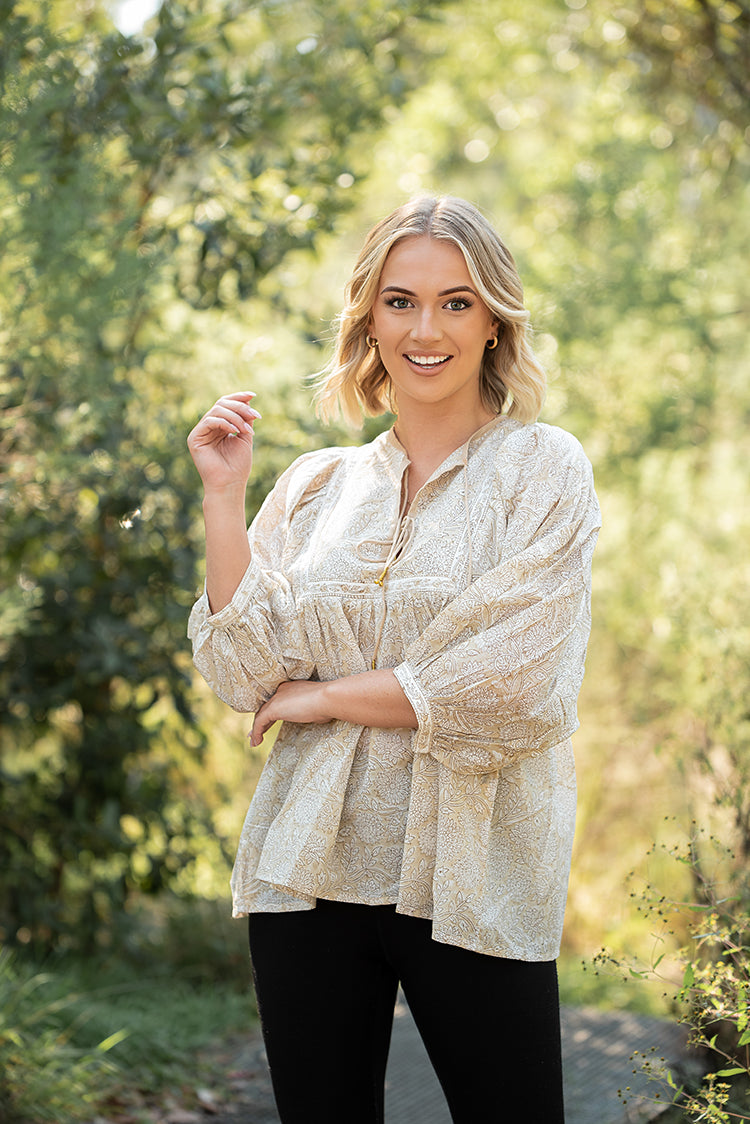Daisy Top is a light floaty Bohemian style top that is sure to become a staple piece in your wardrobe. Featuring a delicate white floral print on stunning beige colourway on 100% cotton fabric. 