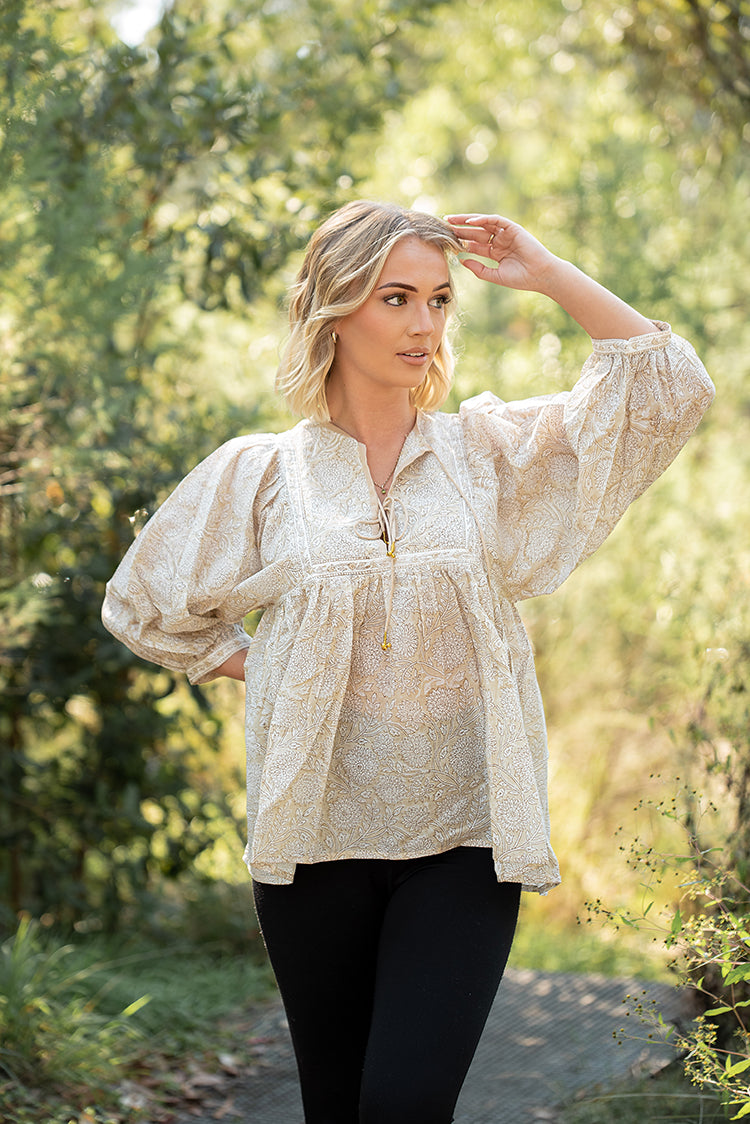 Daisy Top is a light floaty Bohemian style top that is sure to become a staple piece in your wardrobe. Featuring a delicate white floral print on stunning beige colourway on 100% cotton fabric. 