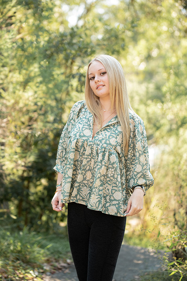 Our Sara Top is a Bohemian style top that is light and flowy. Featuring a floral hand block printed pattern on olive green colourway.
