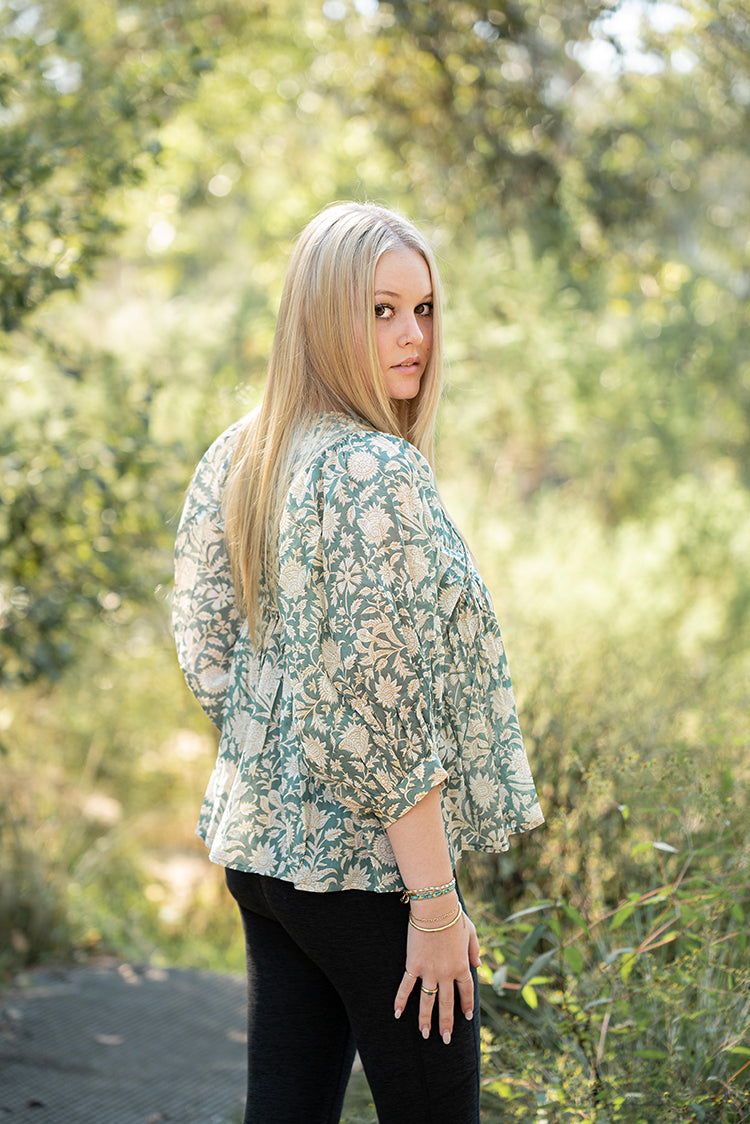 Our Sara Top is a Bohemian style top that is light and flowy. Featuring a floral hand block printed pattern on olive green colourway.