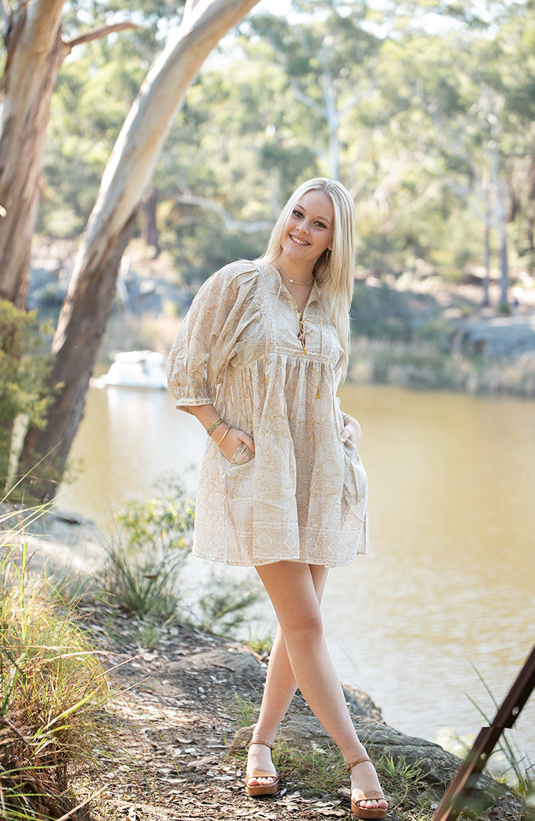 The Daisy Mini Dress is your go to light, flowy, Bohemian style dress. Delicate floral block printed pattern on 100% cotton voile. Mini dress style.