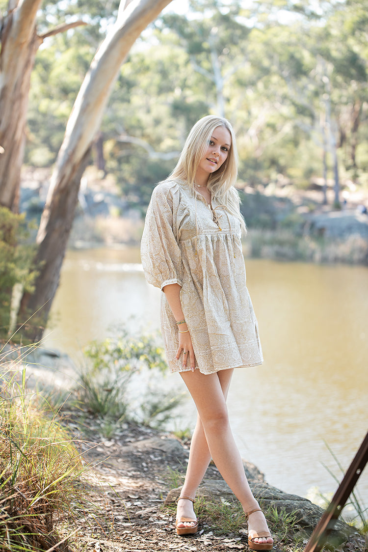 The Daisy Mini Dress is your go to light, flowy, Bohemian style dress. Delicate floral block printed pattern on 100% cotton voile. Mini dress style.