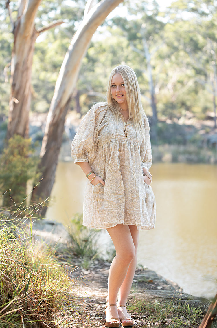 The Daisy Mini Dress is your go to light, flowy, Bohemian style dress. Delicate floral block printed pattern on 100% cotton voile. Mini dress style.