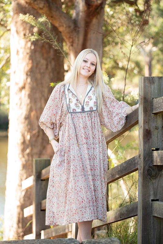 Our Nyla Dress is a stunning Bohemian style dress featuring a contrasting yoke in a simple floral Mehndi pattern. Nyla showcases a cute floral hand block pattern crafted by our partner artisans in Jaipur, India.